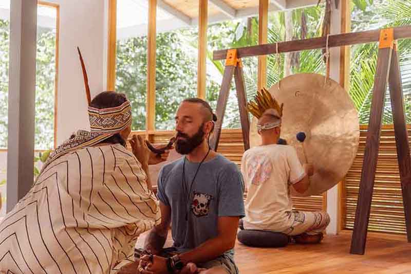 Healing ceremony with gong and hape as part of holistic spiritual practices at our Costa Rica retreat.