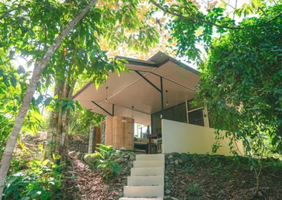 Exterior view of Casita del Tigre surrounded by lush greenery.