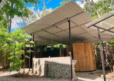 Eco-friendly toilet and shower area at a jungle retreat.