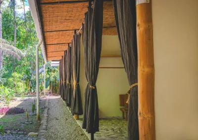 Exterior view of a retreat room with garden surroundings at Templo del Tigre.