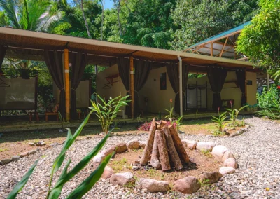 Outdoor fire pit surrounded by seating at Templo del Tigre retreat.