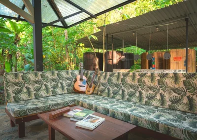 L-shaped sofa seating area next to the outdoor kitchen at Templo del Tigre.