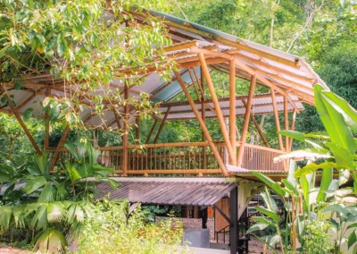 Main building of Templo del Tigre surrounded by tropical jungle in Costa Rica.