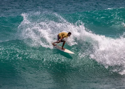 Surfer riding a wave at Matapalo Beach on the Osa Peninsula.