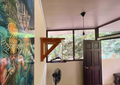 Visionary art by Lobsang hanging on the wall of the double room in the cabin at Templo del Tigre.