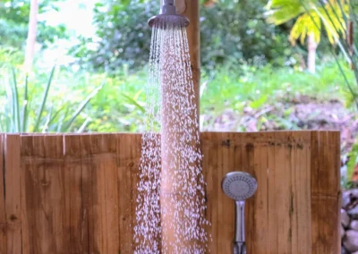 Shower in jungle cabin at Templo del Tigre with flowing water detail.
