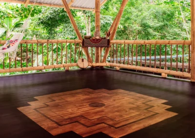 Open-air yoga shala at a retreat center in Costa Rica surrounded by nature.