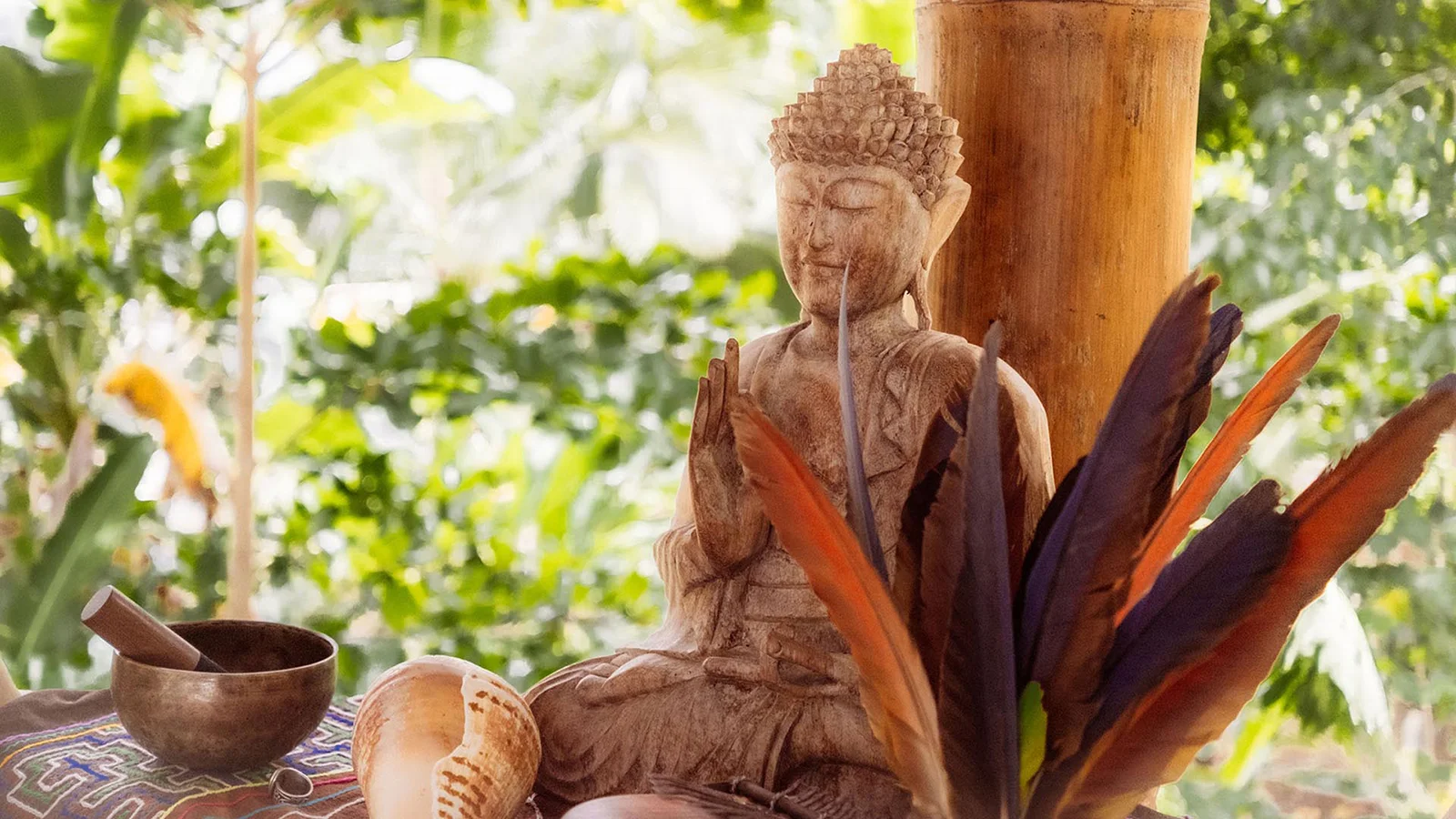altar-buddha-singing-bowl-jungle-yoga Altar with Buddha and singing bowl in jungle yoga shala at Templo del Tigre