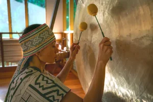 Gong played during an integration ceremony at Templo del Tigre as part of a master plant dieta retreat in the Costa Rican rainforest near Corcovado National Park.