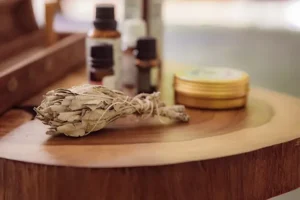 Sacred massage tools at Templo del Tigre, including sage, essential oils, and plant-infused oils used in holistic treatments during retreats in Costa Rica.